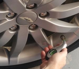 Checking the Tire Pressure on an Aston Martin DB9