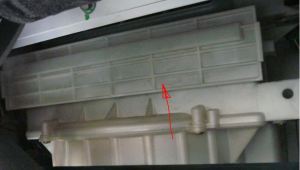 White Plastic Access Cover for Cabin Air Filters on an Aston Martin DB9