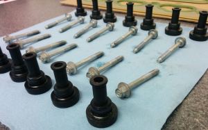 intake-manifold-bolts-and-rubber-isolators-prepared-for-installation-on-an-aston-martin-db9